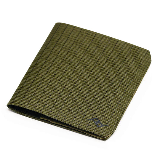 Green grid-patterned notebook on a white background